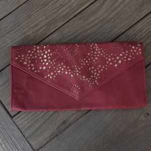 Burgundy and gold cut-out clutch